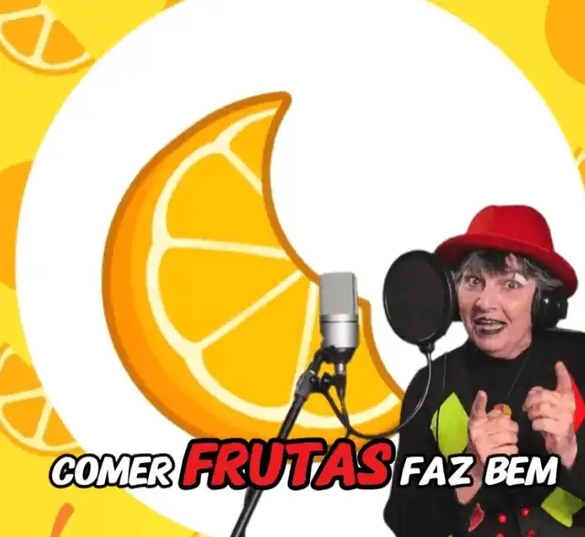 Imagem de divulgação do clipe musical Comer Bem Faz Bem ("Comer Frutas Faz Bem"), com uma artista de chapéu vermelho cantando em frente a um microfone e uma ilustração de laranja ao fundo.